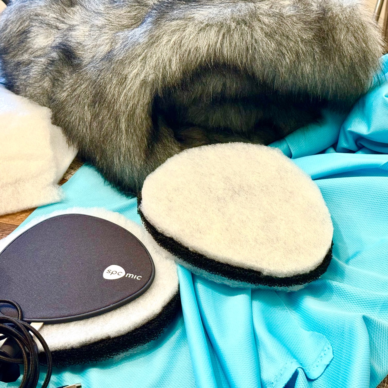 The spcmic beside several pieces of wind protection with custom fur from Radius Windshields.
