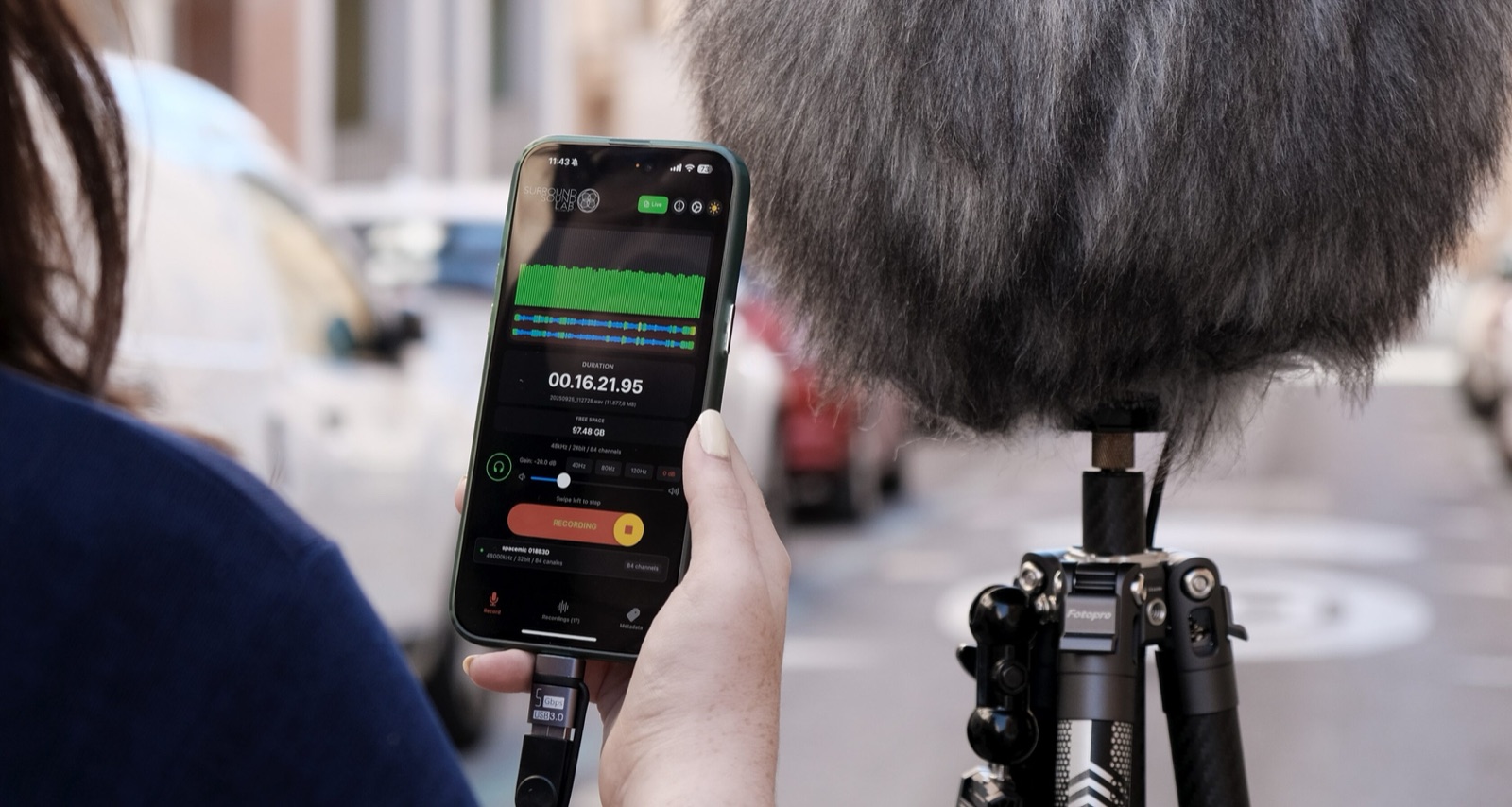 An iPhone running Multichannel REC connected to the spcmic by USB during a field recording.